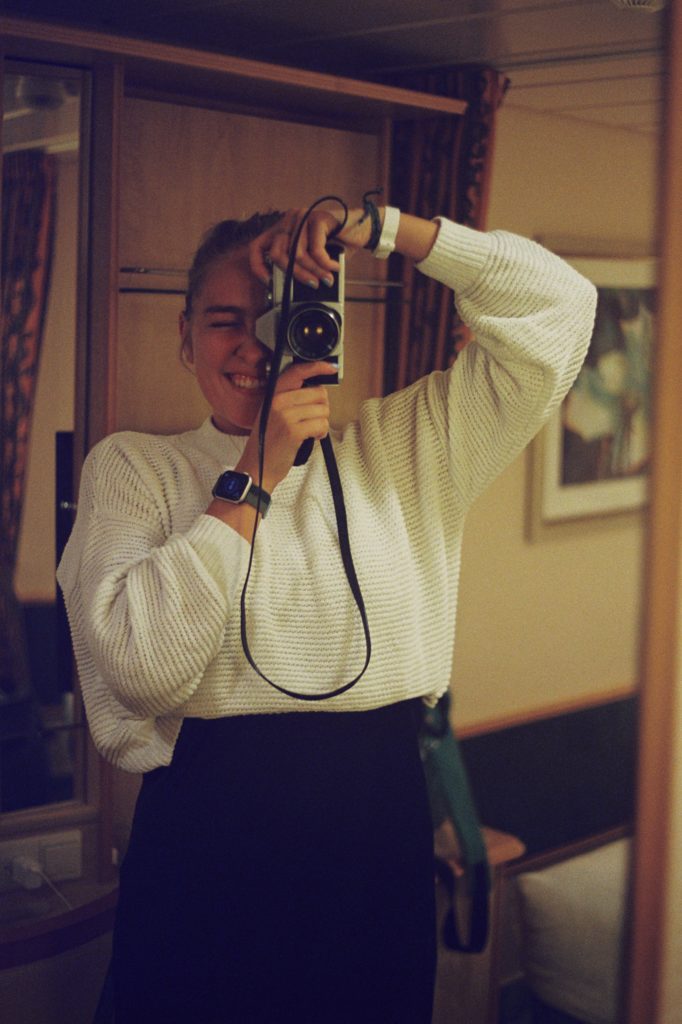 Self-Portrait in Cruise Ship Mirror (Dec. 2022)